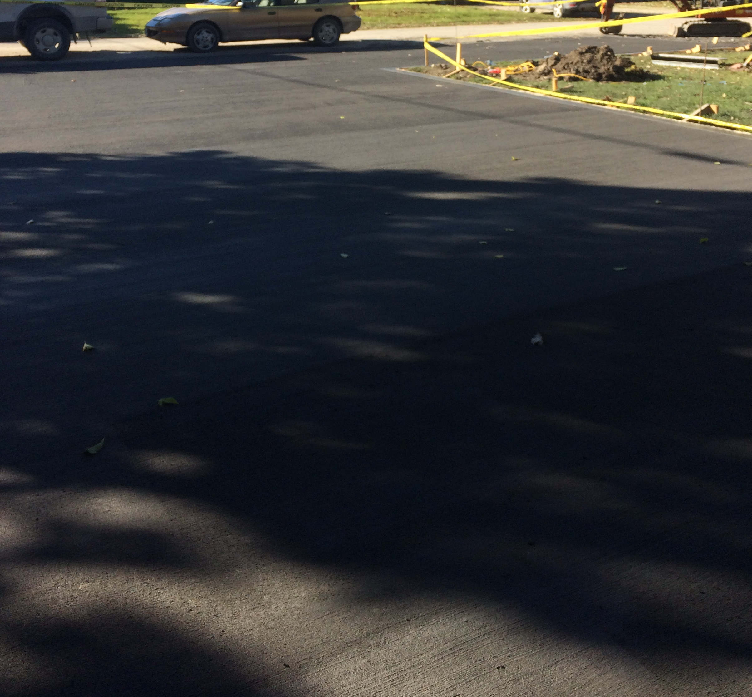 Charcoal black concrete driveway | CAD Concrete And Excavating